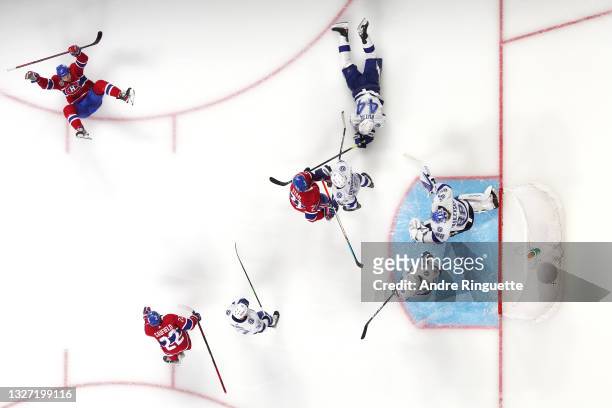 Josh Anderson of the Montreal Canadiens scores the game-winning goal past Andrei Vasilevskiy of the Tampa Bay Lightning to give his team the 3-2 win...