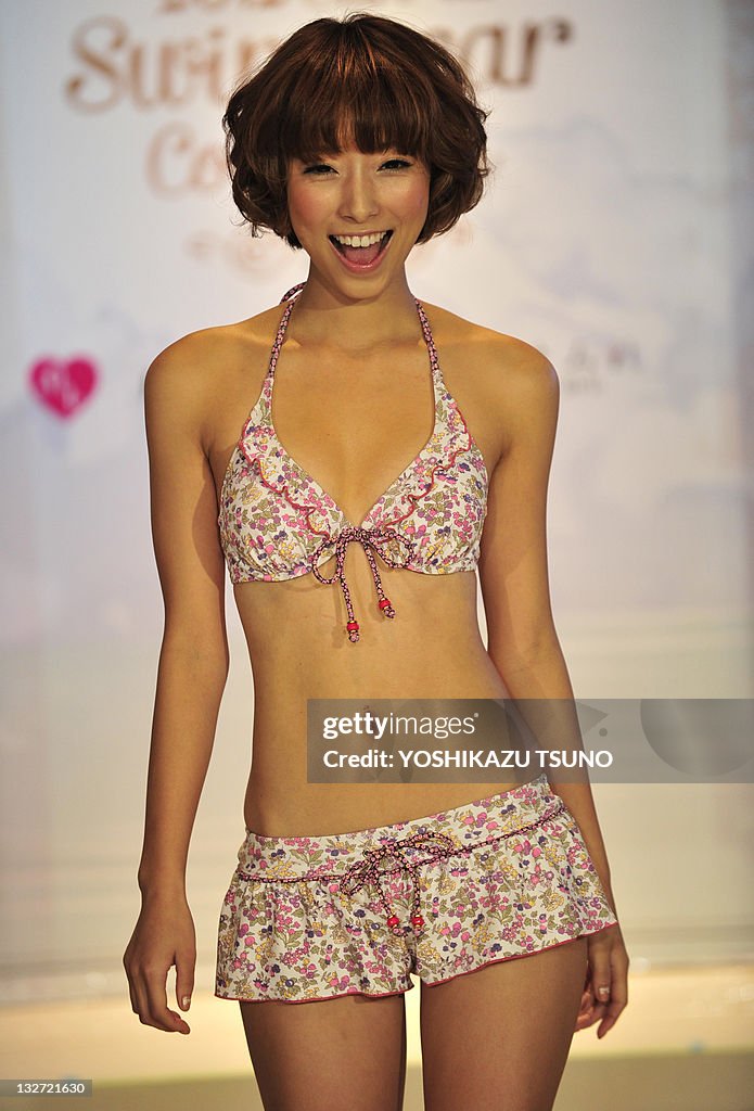 A model displays the latest swimwear dur