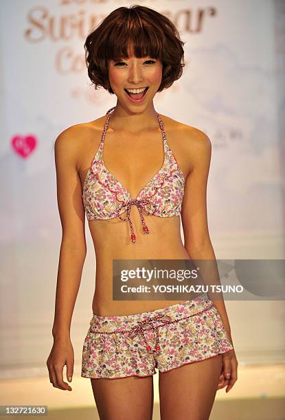 Model displays the latest swimwear during Japanese apparel maker San-ai's 2012 collection in Tokyo on November 14, 2011. Japanese apparel maker...