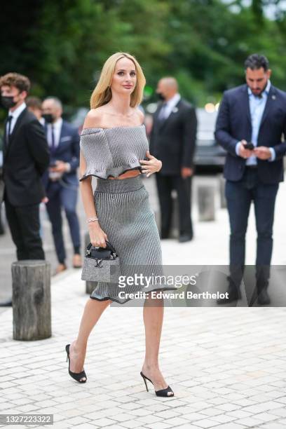 Lauren Santo Domingo wears a gray with black stripes ribbed shoulder-off flowing t-shirt, a matching gray with black stripes ribbed tube knees skirt,...