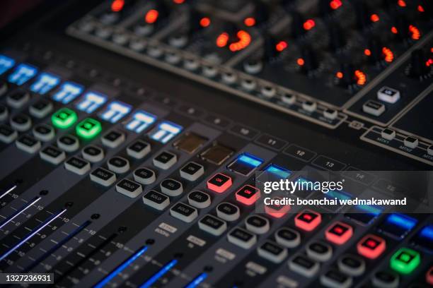 professional sound and audio mixer control panel with buttons and sliders - difusão de televisão imagens e fotografias de stock