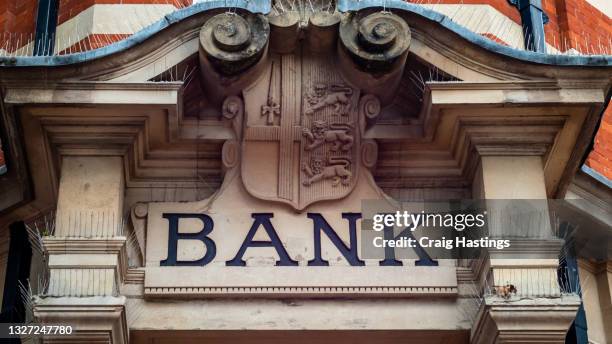 generic british high street banks sign. uk banks stopping account holders buying using or processing crypto related transactions as traditional banking industry declares war on crypto currencies - bank sign ス�トックフォトと画像