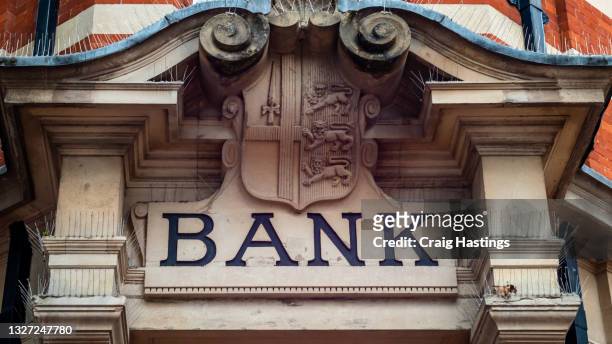 generic british high street banks sign. uk banks stopping account holders buying using or processing crypto related transactions as traditional banking industry declares war on crypto currencies - banking stock pictures, royalty-free photos & images