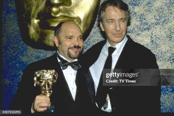 Actor Alan Rickman and director Anthony Minghella photographed at the BAFTA Film and Television Awards at the Royal Albert Hall in London on April...