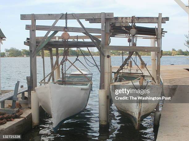 May 7: Old boats line the dock on Pigeon Cay, a tiny fishing village near the island of Utila. Pigeon Cay has many tiny grocery stores where...