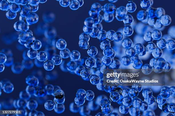 small blue nanoparticles - nanotecnología fotografías e imágenes de stock