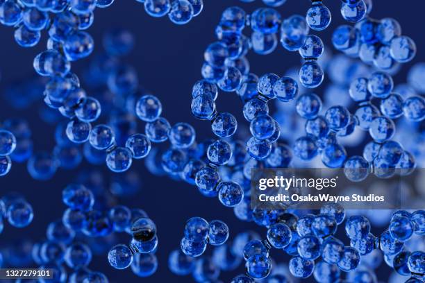 small blue nanoparticles - nanotechnology stock pictures, royalty-free photos & images
