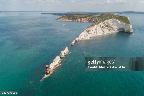 daytime arial shot looking back at the needles, isle of wight, united kingdom - solent stock pictures, royalty-free photos & images