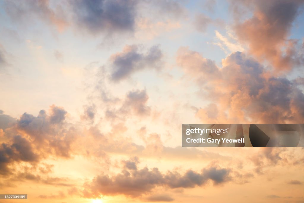Fluffy clouds at sunset