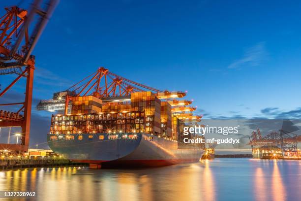 container terminal and transportation - dramatischer himmel stock pictures, royalty-free photos & images