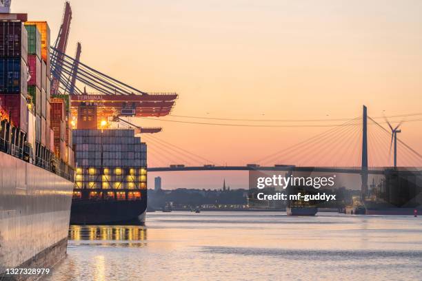 container terminal and transportation - dramatischer himmel stock pictures, royalty-free photos & images