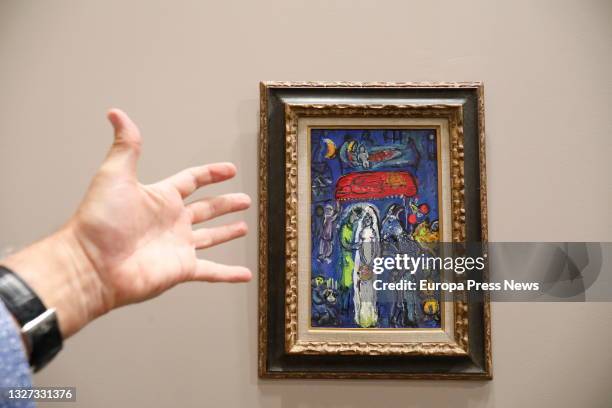 Man points to a painting by Marc Chagall in one of the halls belonging to the International Contemporary Art Festival, ARCO, on July 6 in Madrid,...
