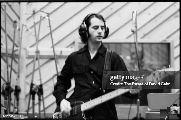 American musician, producer, and bassist Garry Tallent poses for a portrait with his bass guitar in March, 1980 at The Power Station, a recording...