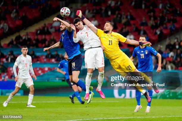 Gianluigi Donnarumma of Italy makes a save whilst under pressure from Alvaro Morata of Spain during the UEFA Euro 2020 Championship Semi-final match...