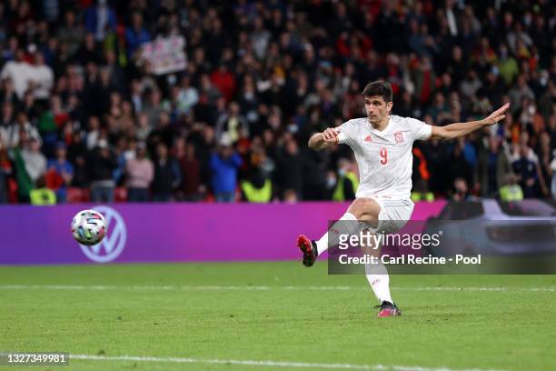 Gerard Moreno of Spain scores their team's second penalty in the penalty shoot out during the UEFA Euro 2020 Championship Semi-final match between...
