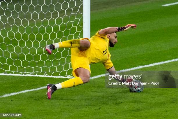 Gianluigi Donnarumma of Italy saves the fourth penalty from Alvaro Morata of Spain in the penalty shoot out during the UEFA Euro 2020 Championship...