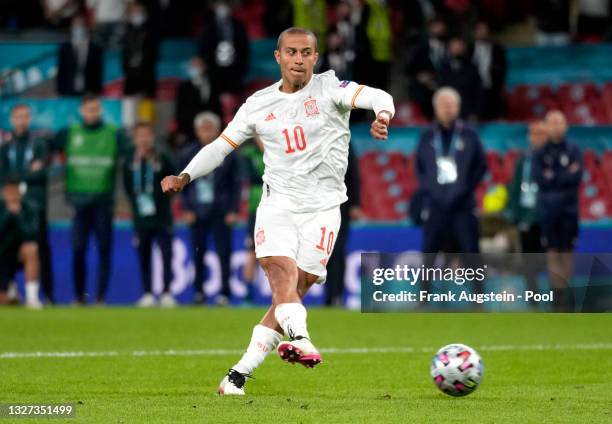 Thiago Alcantara of Spain scores their team's third penalty in the penalty shoot out during the UEFA Euro 2020 Championship Semi-final match between...