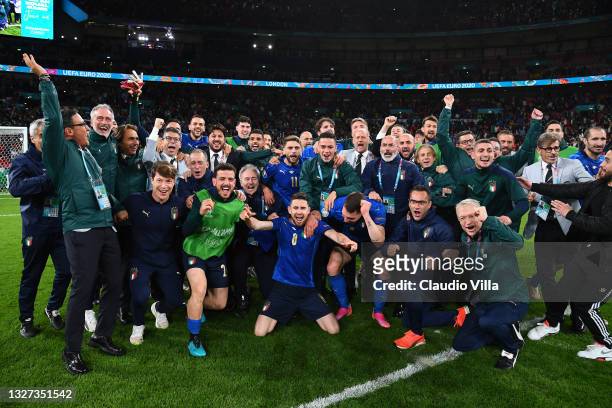 Players of Italy celebrate following their team's victory in the penalty shoot out after the UEFA Euro 2020 Championship Semi-final match between...
