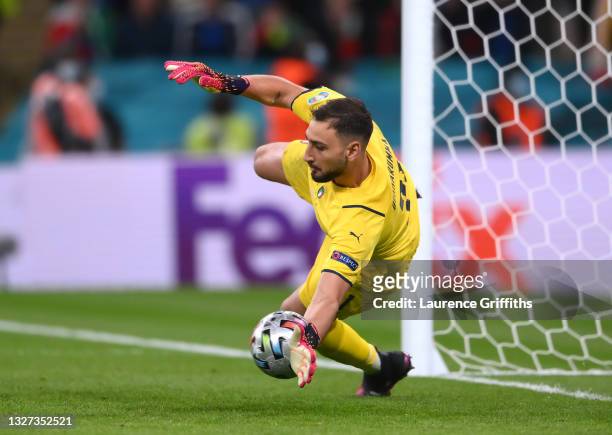 Gianluigi Donnarumma of Italy saves the fourth penalty from Alvaro Morata of Spain in the penalty shoot out during the UEFA Euro 2020 Championship...