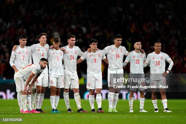 Jordi Alba, Alvaro Morata, Pau Torres, Marcos Llorente, Aymeric Laporte, Gerard Moreno, Rodri, Pedri and Thiago Alcantara of Spain look dejected...