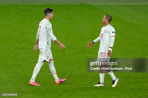 Thiago Alcantara of Spain consoles teammate Alvaro Morata of Spain who looks dejected as he misses his team's fourth penalty in a penalty shoot out...