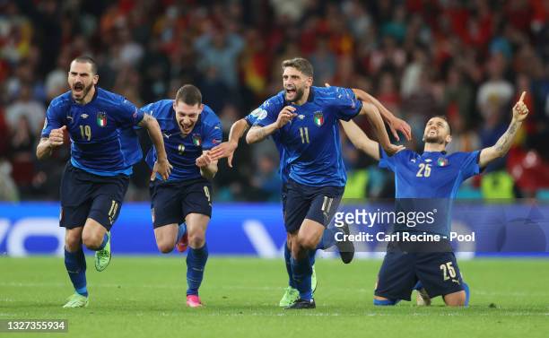 Leonardo Bonucci, Andrea Belotti, Domenico Berardi and Rafael Toloi of Italy celebrate following their team's victory in the penalty shoot out after...