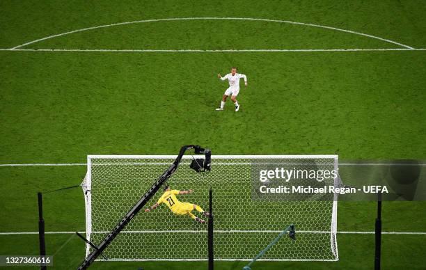 Thiago Alcantara of Spain scores their team's third penalty in a penalty shoot out during the UEFA Euro 2020 Championship Semi-final match between...