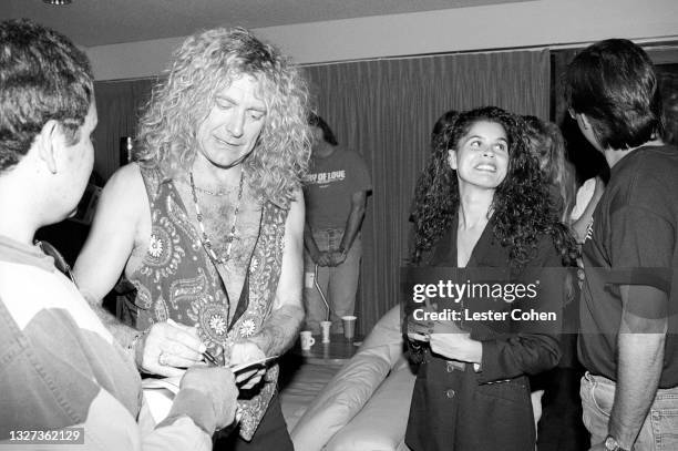 British singer and songwriter Robert Plant signs autographs circa October, 1993 in Los Angeles, California.