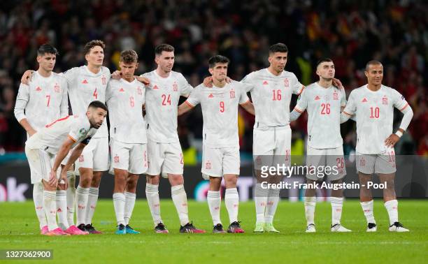 Jordi Alba, Alvaro Morata, Pau Torres, Marcos Llorente, Aymeric Laporte, Gerard Moreno, Rodri, Pedri and Thiago Alcantara of Spain look dejected...