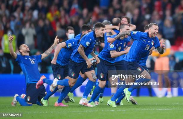 Giovanni Di Lorenzo, Leonardo Bonucci and Federico Bernardeschi of Italy celebrate following their team's victory in the penalty shoot out after the...