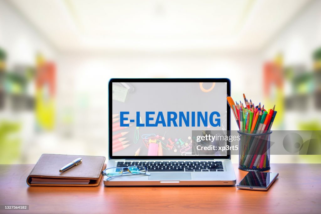 Elearning Desk Open Laptop With Isolated White Screen On Old Wooden Desk With Text ...