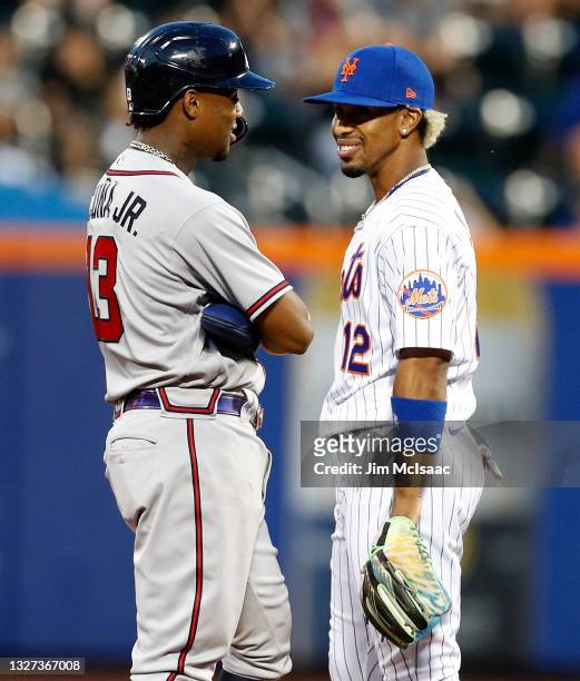 Ronald Acuna Jr. #13 of the Atlanta Braves and Francisco Lindor of the New York Mets talk at Citi Field on June 21, 2021 in New York City. The Braves...