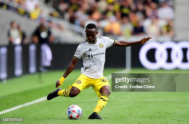 Harrison Afful of Columbus Crew makes a pass during their game against the New England Revolution at Lower.com Field on July 03, 2021 in Columbus,...