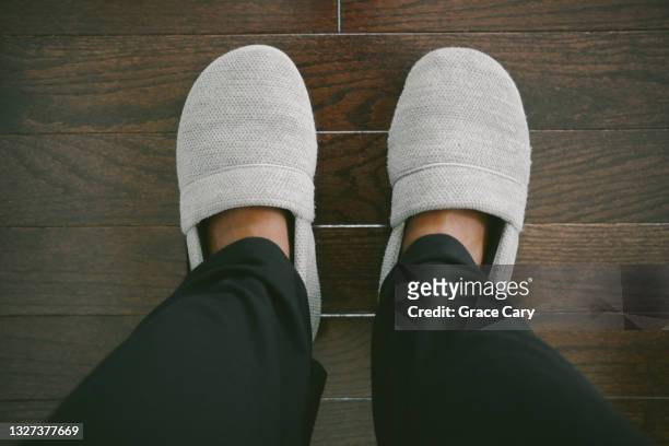 woman's slippered feet - gray shoe stock pictures, royalty-free photos & images
