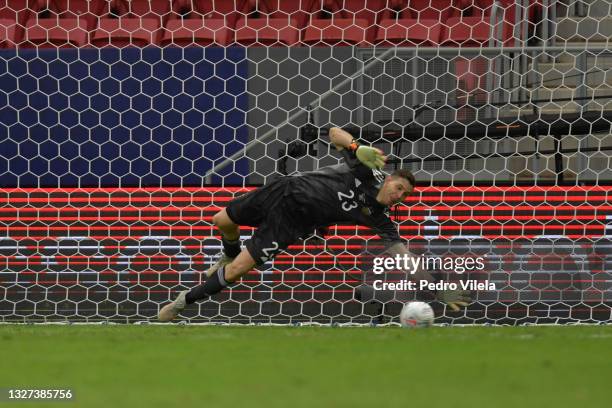 Emiliano Martinez goalkeeper of Argentina dives to save penalty kick by Davinson Sanchez of Colombia in a shootout after a semi-final match of Copa...