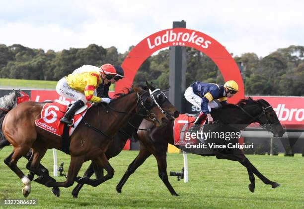 Fred Kersley riding Lady In The Sky defeats Jamie Kah riding Murrumbidgee River in Race 2, the Ladbrokes Switch Handicap during Melbourne Racing at...