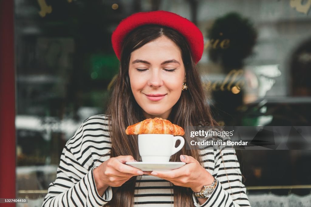 Young woman with croissant