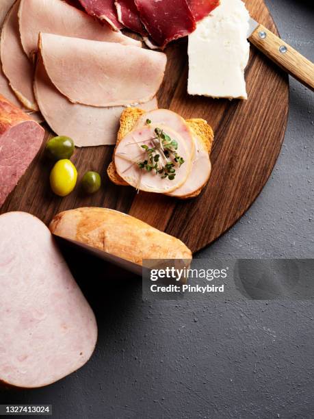 cold meat plate, ham and meat delicatessen, assorted meat snacks, meat appetizer platter, charcuterie board, smoked boneless ham - sliced ham stock pictures, royalty-free photos & images