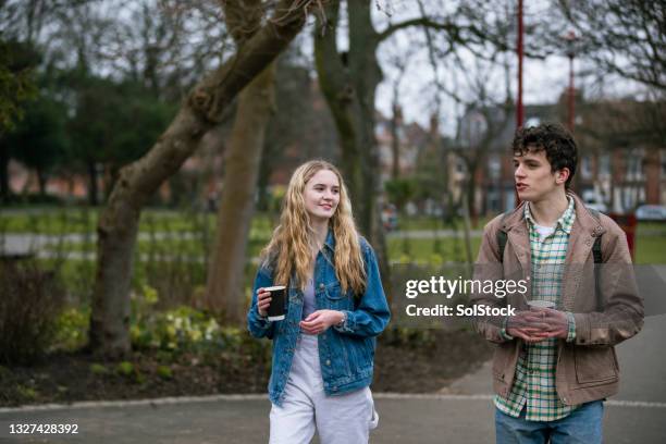 teenage friends having a chat - two people side by side stock pictures, royalty-free photos & images