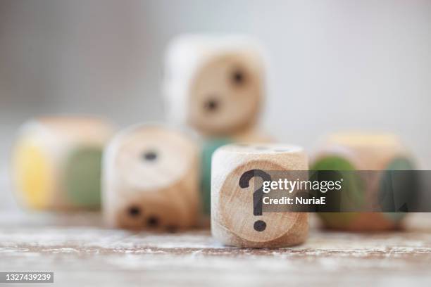 close-up of wooden dice on a wooden table - sorte imagens e fotografias de stock