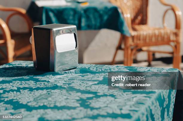 paper napkin serviette holder on cafe table - napkin holder stock pictures, royalty-free photos & images
