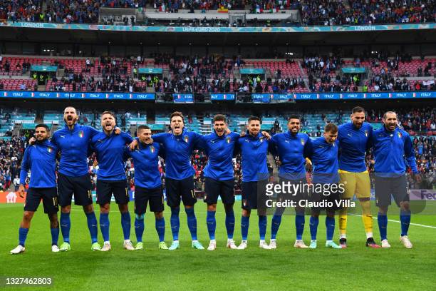 Players of Italy sing the national anthem prior to the UEFA Euro 2020 Championship Semi-final match between Italy and Spain at Wembley Stadium on...