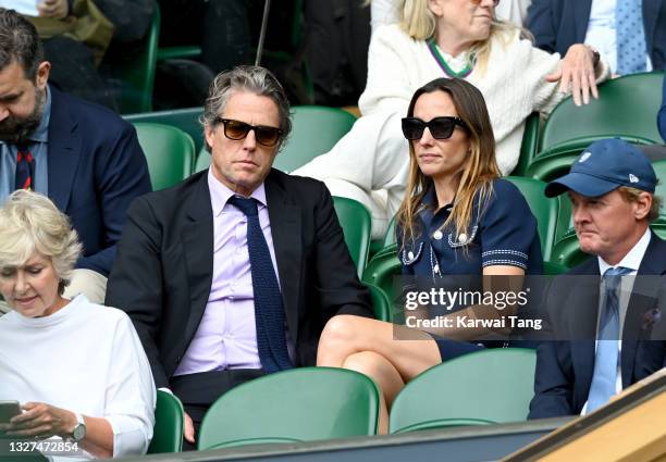 Hugh Grant and Anna Eberstein attend Wimbledon Championships Tennis Tournament at All England Lawn Tennis and Croquet Club on July 07, 2021 in...