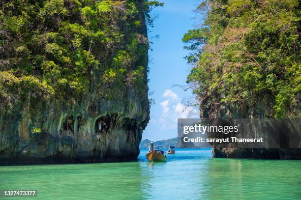 seas and islands surround the sandy beach of koh hong in krabi, thailand. - phuket thailand stock pictures, royalty-free photos & images