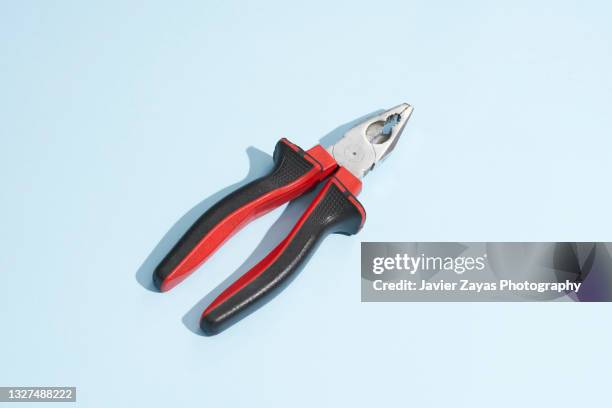 pliers on blue background - pliers stock pictures, royalty-free photos & images