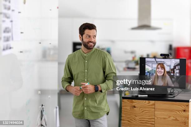 man presenting his business ideas to team in office - employee engagement remote stock pictures, royalty-free photos & images