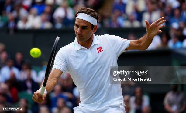 Roger Federer of Switzerland plays a backhand during his men's Singles Quarter Final match against Hubert Hurkacz of Poland on Day Nine of The...