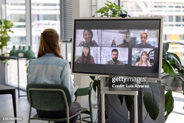 woman having online meeting with team - remote location stock pictures, royalty-free photos & images