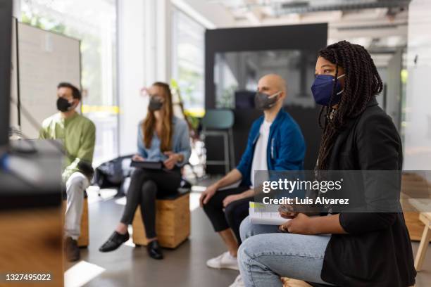 business people having video conference meeting during pandemic - パンデミック ストックフォトと画像