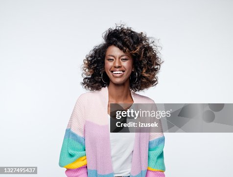 Excited woman wearing rainbow cardigan Excited woman wearing rainbow cardigan